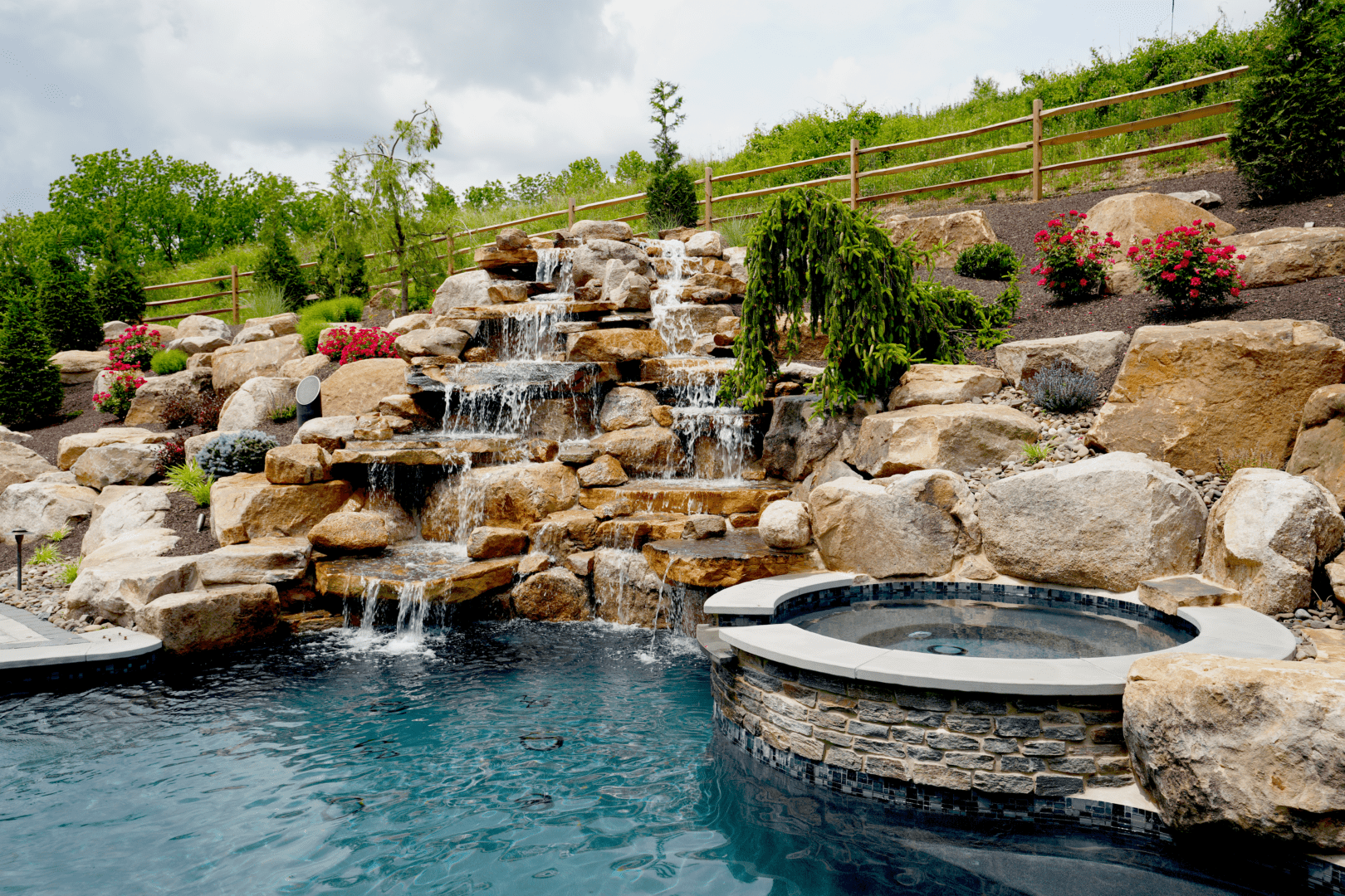 The allure of the small pool rock waterfalls for your pool